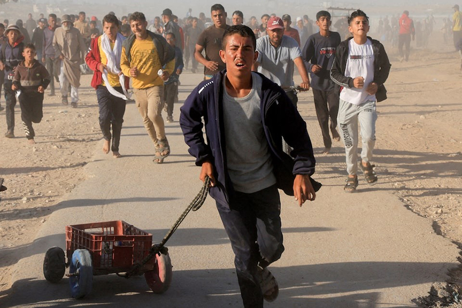 Palestinians walk to collect aid supplies from the US-backed Gaza Humanitarian Foundation, in Khan Younis, in the southern Gaza Strip on May 29, 2025 — Reuters/File