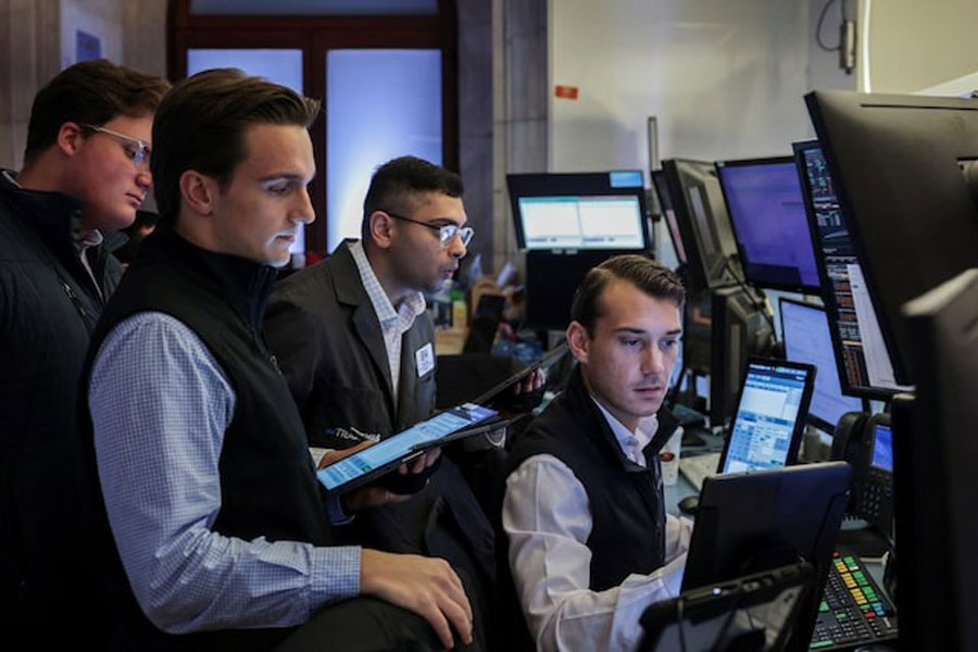 Traders work on the floor at the New York Stock Exchange (NYSE) in New York City, US, July 15, 2025.