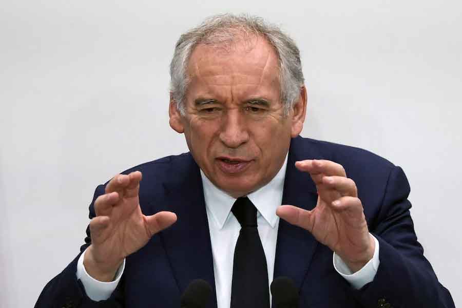 French Prime Minister Francois Bayrou gestures as he speaks during a conference to outline the priorities for the public finances in a first step towards preparing the next budget, in Paris, France, April 15, 2025.