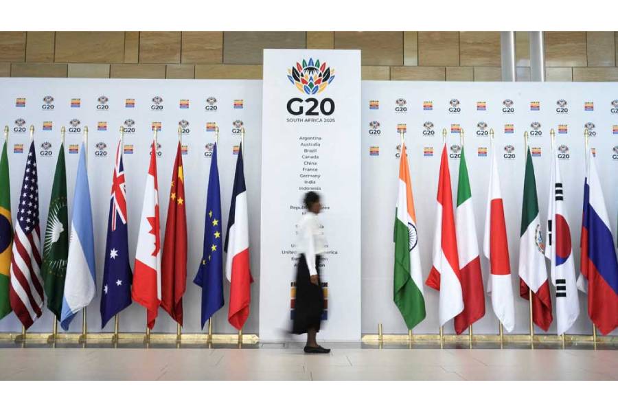 A woman walks at the Cape Town International Convention Centre during the G20 Finance Ministers meeting in Cape Town, South Africa Feb 24, 2025.