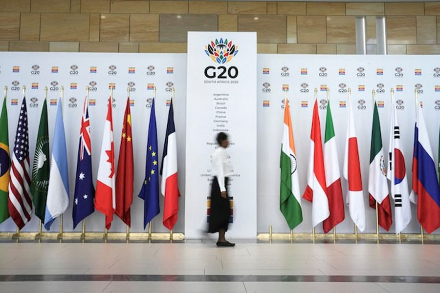 A woman walks at the Cape Town International Convention Centre during the G20 Finance Ministers meeting in Cape Town, South Africa February 24, 2025.