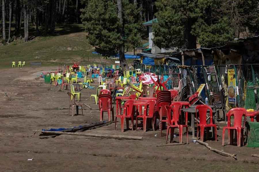 Chairs and tables are scattered at the site of a suspected militant attack on tourists in Baisaran near Pahalgam in south Kashmir's Anantnag district, April 24, 2025.