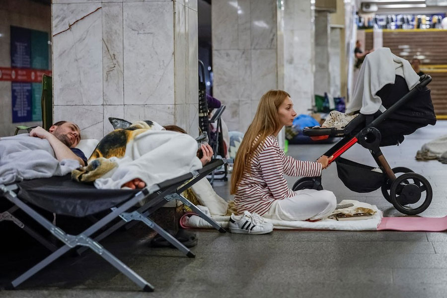 Daria Slavytska, 27, takes shelter inside a metro station with her 2-year-old son Emil during a Russian missile and drone strike, amid Russia's attack on Ukraine, in Kyiv, Ukraine July 9, 2025.