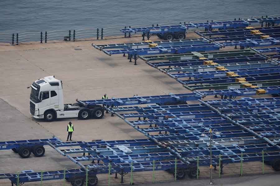 Employees work at Pyeongtaek port in Pyeongtaek, South Korea, July 8, 2025.