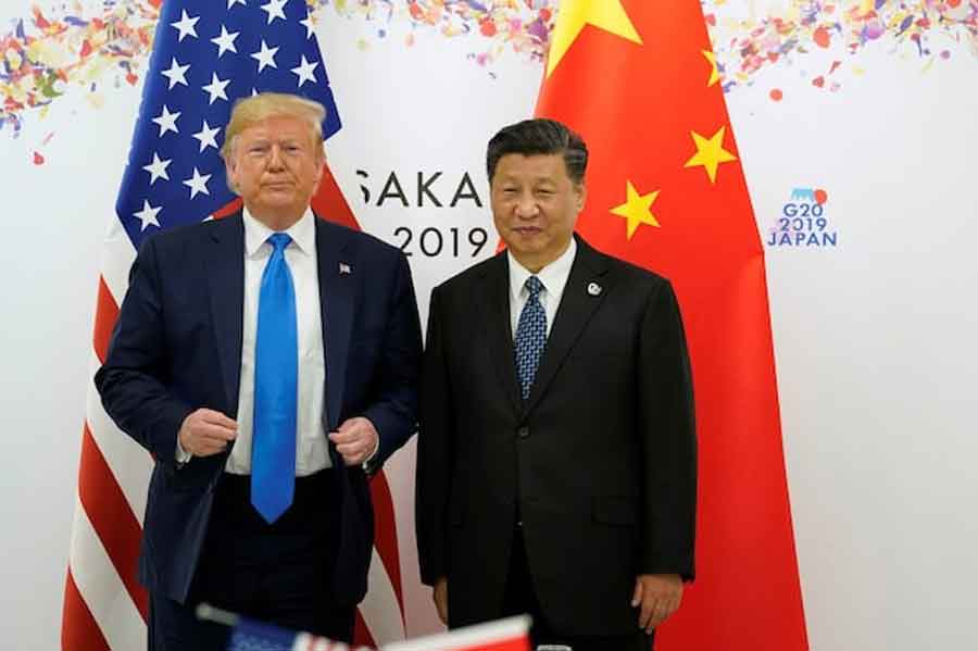 US President Donald Trump and China's President Xi Jinping pose for a photo ahead of their bilateral meeting during the G20 leaders summit in Osaka, Japan, June 29, 2019.
