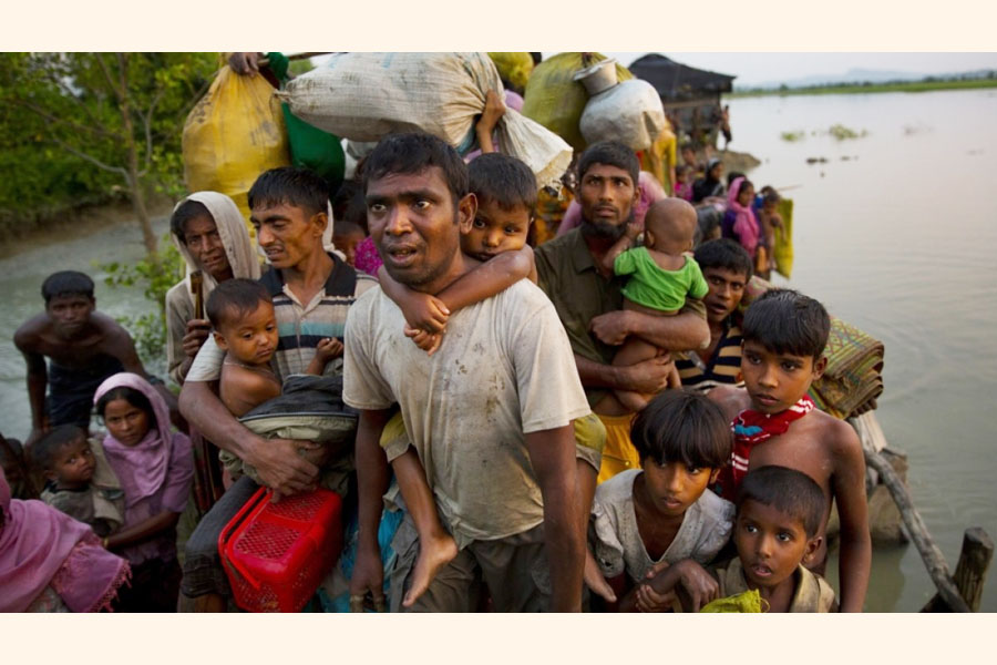 Rohingya Muslims carry their young children and belongings after crossing the border from Myanmar into Bangladesh, near Palong Khali, Bangladesh, Wednesday, Nov. 1, 2017 —Agency Photo