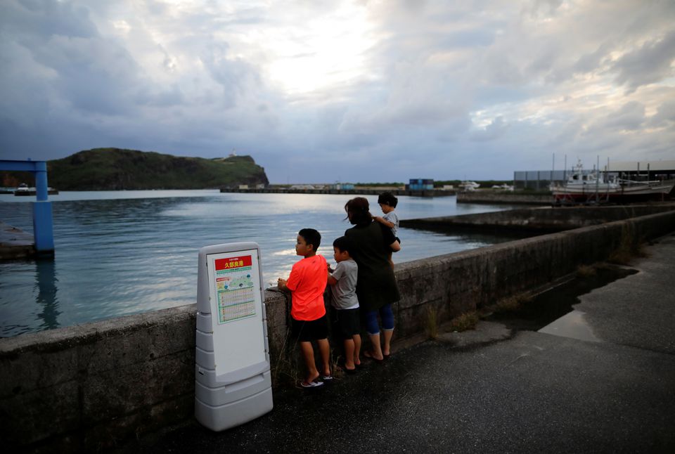 Local children look on at Japan's westernmost inhabited Yonaguni Island in Yonaguni, Okinawa prefecture, Japan, October 26, 2021. Picture taken October 26, 2021. REUTERS/Issei Kato/File Photo