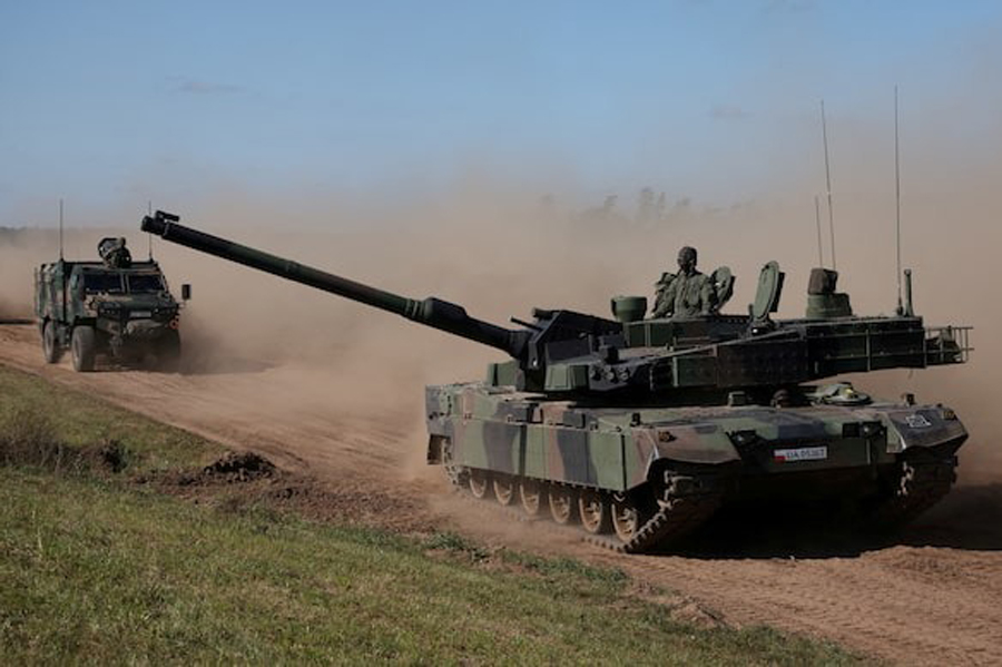 Polish soldiers ride the South Korean-made K2 tank during trial drills prior to annual artillery show ‘Autumn Fire 23’ at a military range in Bemowo Piskie near Orzysz, Poland, September 16, 2023.