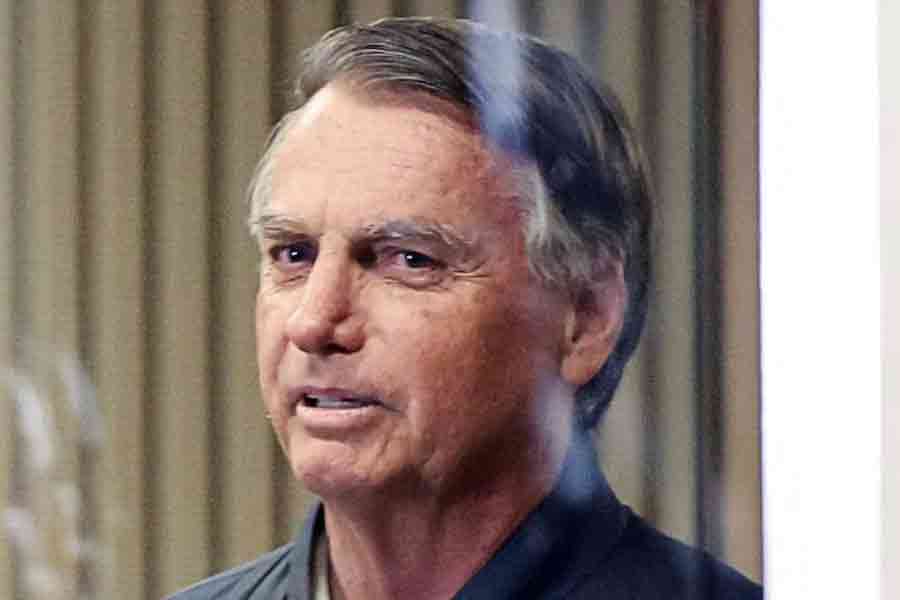 Former Brazilian President Jair Bolsonaro leaves the Liberal Party headquarters in Brasilia, Brazil, Jul 23, 2025.