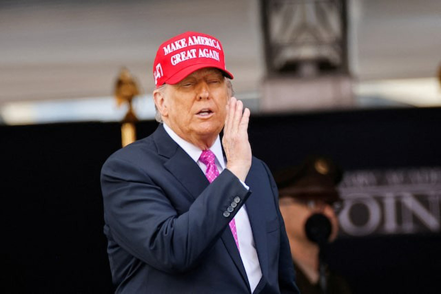 US President Donald Trump wears a 'Make America Great Again' (MAGA) hat as he attends the commencement ceremony at West Point Military Academy in West Point, New York, US, May 24, 2025.