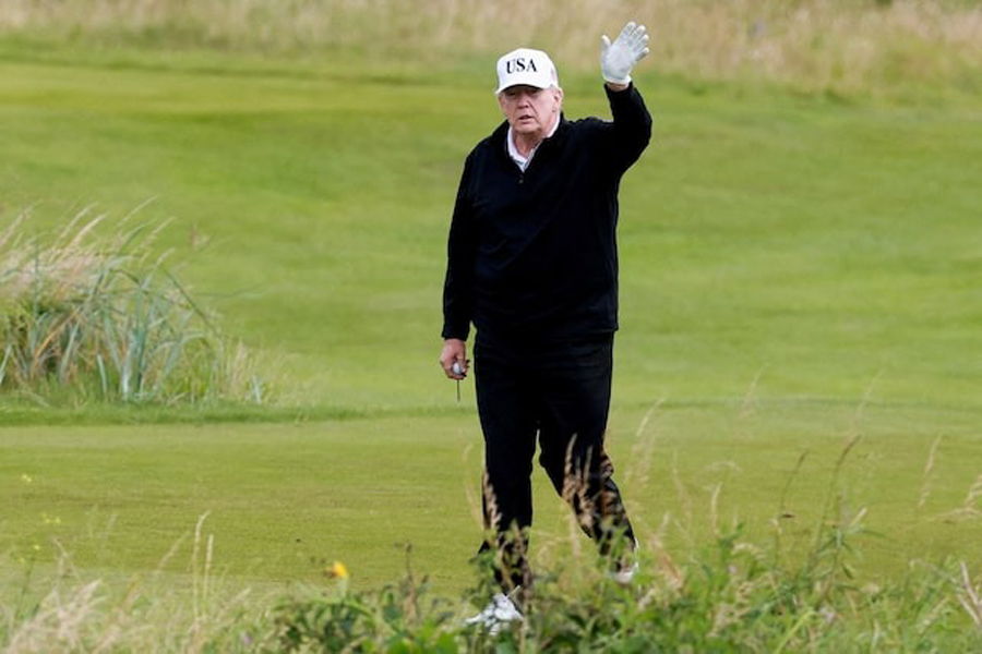 US President Donald Trump waves on the golf course at Trump Turnberry resort in Turnberry, Scotland, Britain, July 26, 2025.