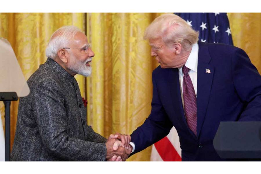 US President Donald Trump and Indian Prime Minister Narendra Modi shake hands as they attend a joint press conference at the White House in Washington DC, US, Feb 13, 2025.