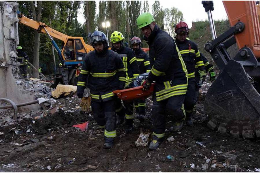 Rescuers carry the body of a person found under debris of an apartment building which was hit a day before, by a Russian missile strike, amid Russia’s attack on Ukraine, in Kyiv, Ukraine, in this handout picture released Aug 1, 2025.