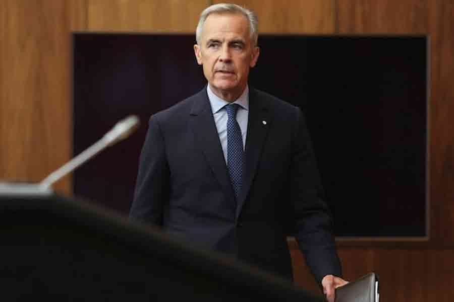 Canada's Prime Minister Mark Carney arrives at a press conference to make an announcement on recognizing Palestinian statehood, in Ottawa, Ontario, Canada, July 30, 2025.
