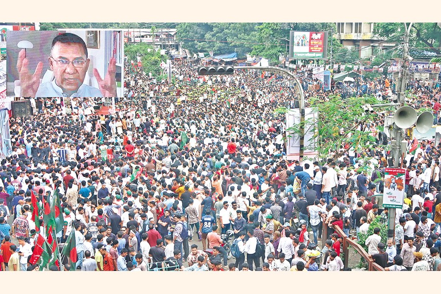 BNP acting Chairman Tarique Rahman, inset, addresses a rally virtually, organised by Jatiyatabadi Chhatra Dal at Shahbagh intersection in Dhaka on Sunday, marking the first anniversary of the July-August uprising