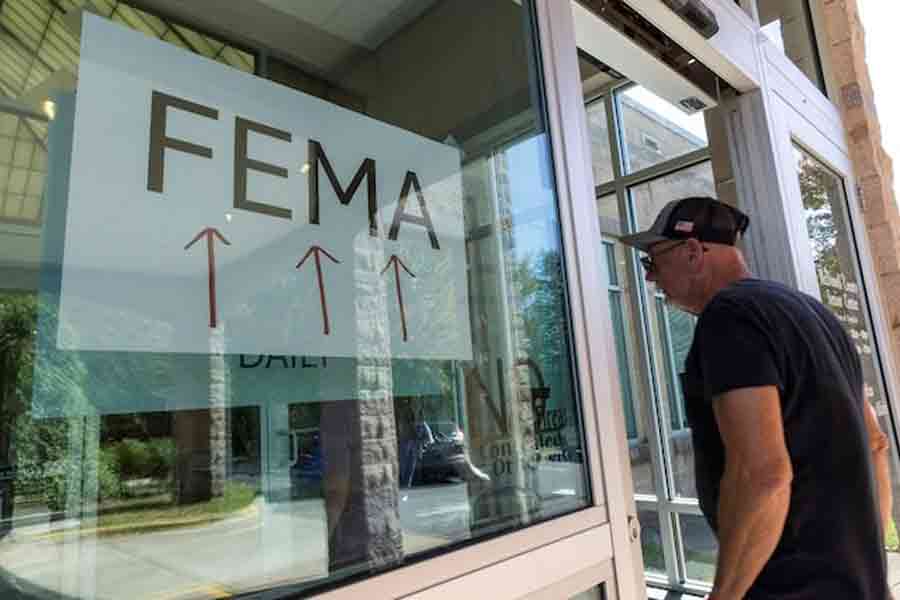 A resident enters a FEMA's improvised station to attend claims by local residents affected by floods following the passing of Hurricane Helene, in Marion, North Carolina, US, October 5, 2024.