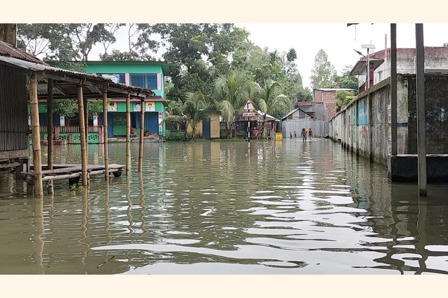 A flooded street after heavy monsoon rains induced a rise in water level of Teesta and Dharla rivers. The photo was taken from Mohishkhocha under Aditmari upazilla of Lalmonirhat district- FE Photo