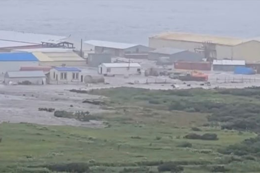 A powerful wave washes past a building located near the shore, after a powerful earthquake struck off the Kamchatka Peninsula, in Severo-Kurilsk, Sakhalin Region, Russia July 30, 2025 in this screen grab obtained from social media video — Social media/via REUTERS/File