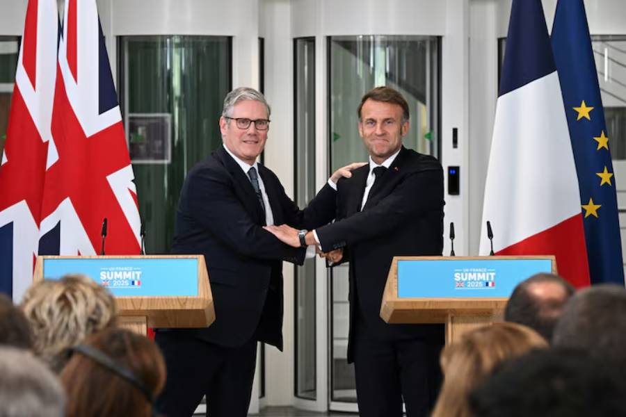 British Prime Minister Keir Starmer (L) and French President Emmanuel Macron shake hands as they hold a press conference on July 10, 2025 in London, England.