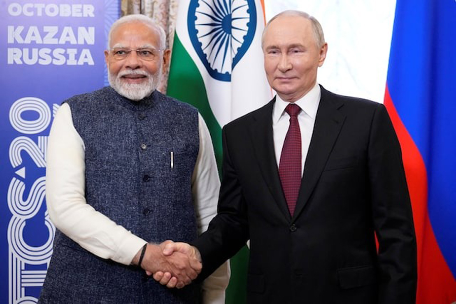 Russian President Vladimir Putin shakes hands with Indian Prime Minister Narendra Modi during their meeting on the sidelines of the BRICS Summit in Kazan, Russia October 22, 2024.