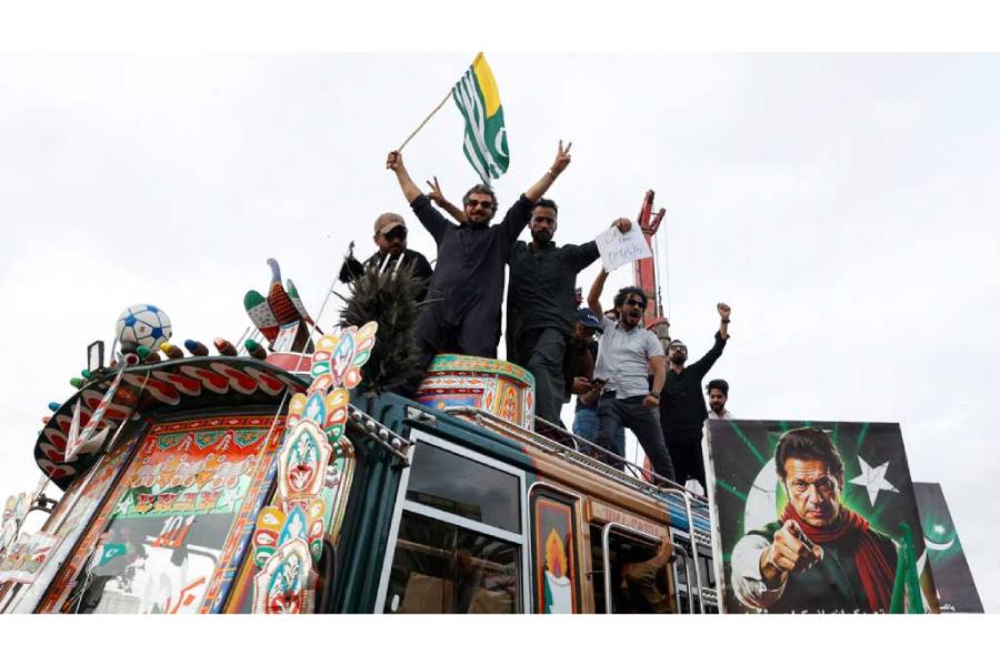 Supporters of Pakistan’s former Prime Minister Imran Khan and his party, Pakistan Tehreek-e-Insaf (PTI), gesture atop a van during a nationwide protest demanding Khan’s release on the second anniversary of his jailing, in Karachi, Pakistan, Aug 5, 2025.