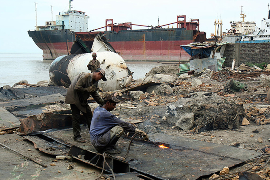 Workers at a ship breaking factory