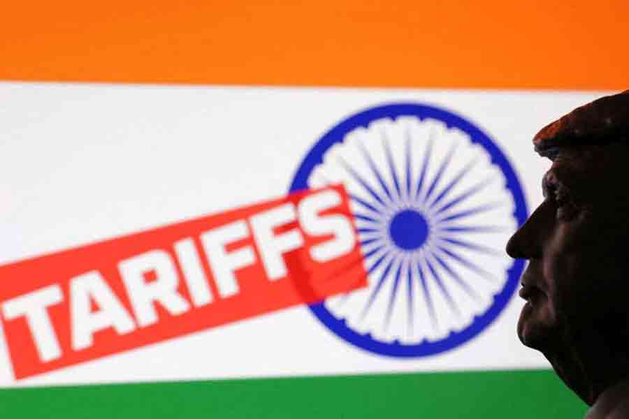 A 3D-printed miniature model of US President Donald Trump, the Indian flag and the word "Tariffs" are seen in this illustration taken Jul 23, 2025.