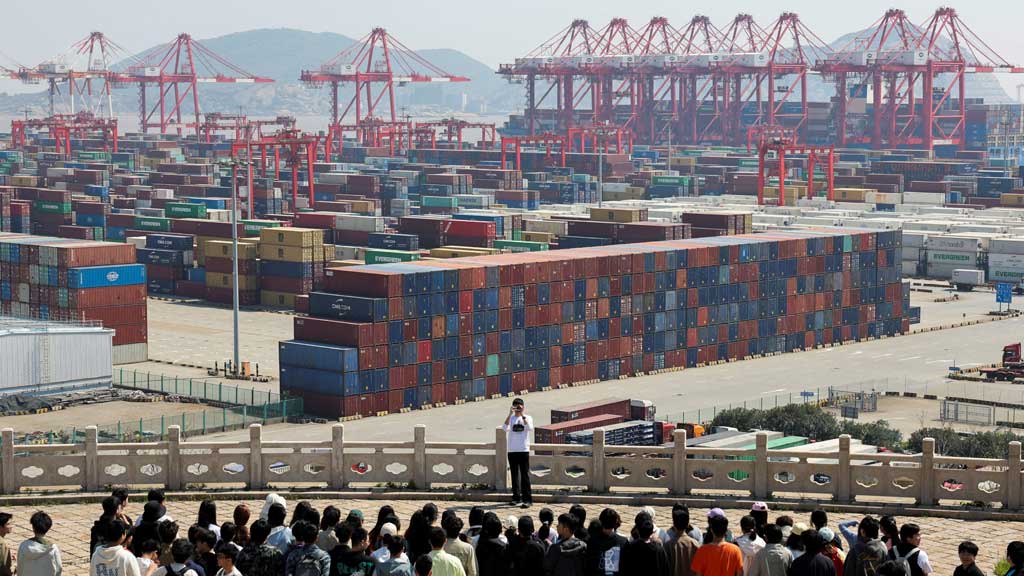 FILE PHOTO: Visitors pose for photos at a lookout in Yangshan Port outside of Shanghai, China, Apr 15, 2025. REUTERS/Go Nakamura /File Photo