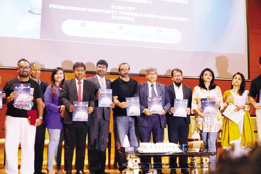 Vice Chancellor of North South University Professor Abdul Hannan Chowdhury along with the organisers and guests pose for a photo at the 10th International Business Genius Bangladesh - 2025 at NUS auditorium on Saturday