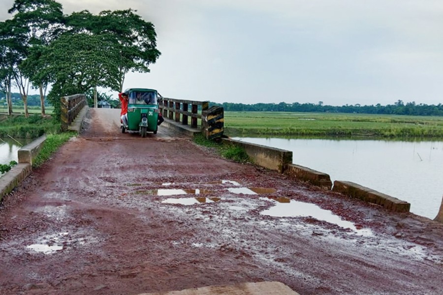 Potholes developed at Salutikor-Gowainghat road in Sylhet district