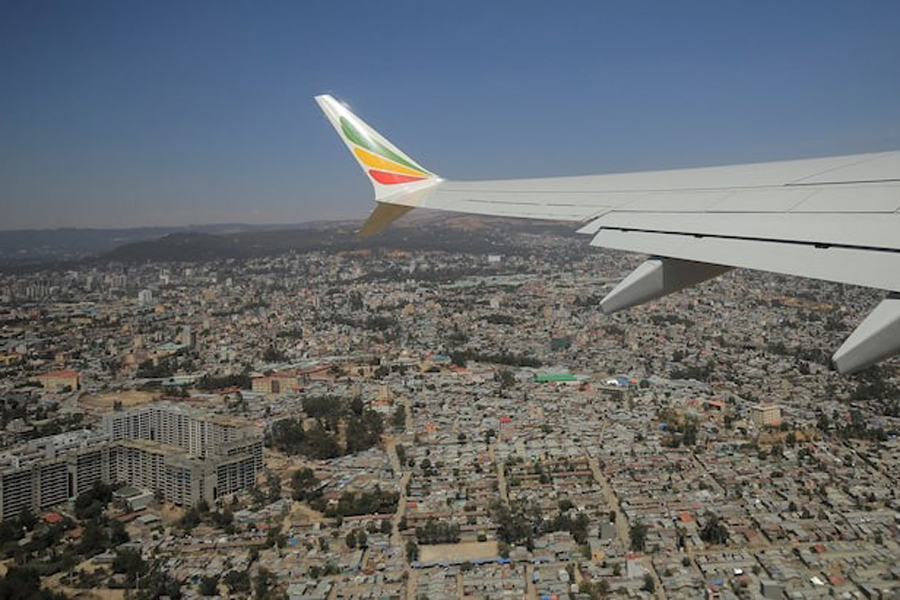 The wing of an Ethiopian Airlines Boeing plane is seen over the skies of Addis Ababa, Ethiopia, February 1, 2022.