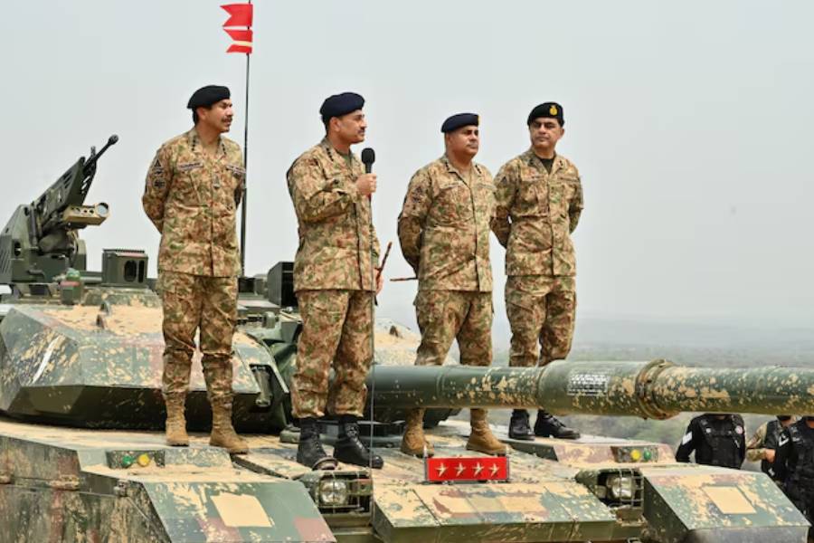 Chief of Army Staff of Pakistan Asim Munir holds a microphone during his visit at the Tilla Field Firing Ranges (TFFR) in Mangla, Pakistan May 1, 2025.