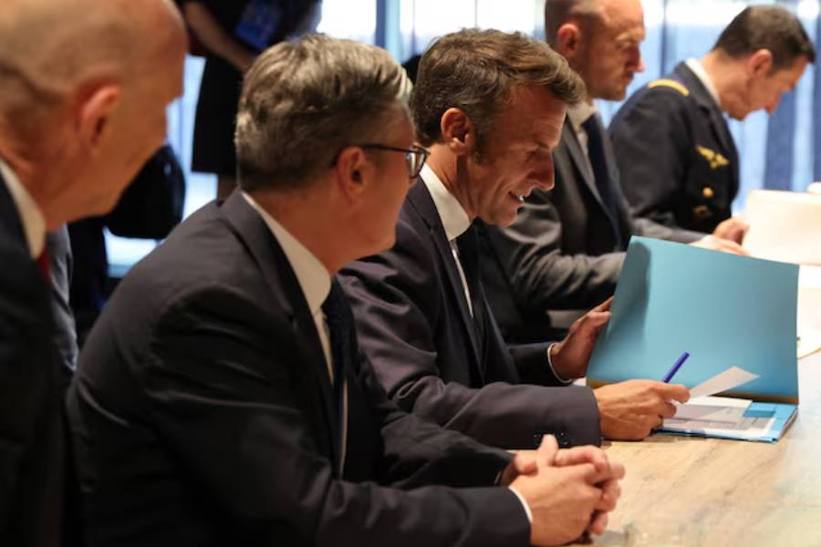 France's President Emmanuel Macron and Britain's Prime Minister Keir Starmer meet with Germany's Chancellor Friedrich Merz (not pictured) on the sidelines of the two-day NATO's Heads of State and Government summit, in The Hague, Netherlands June 24, 2025.