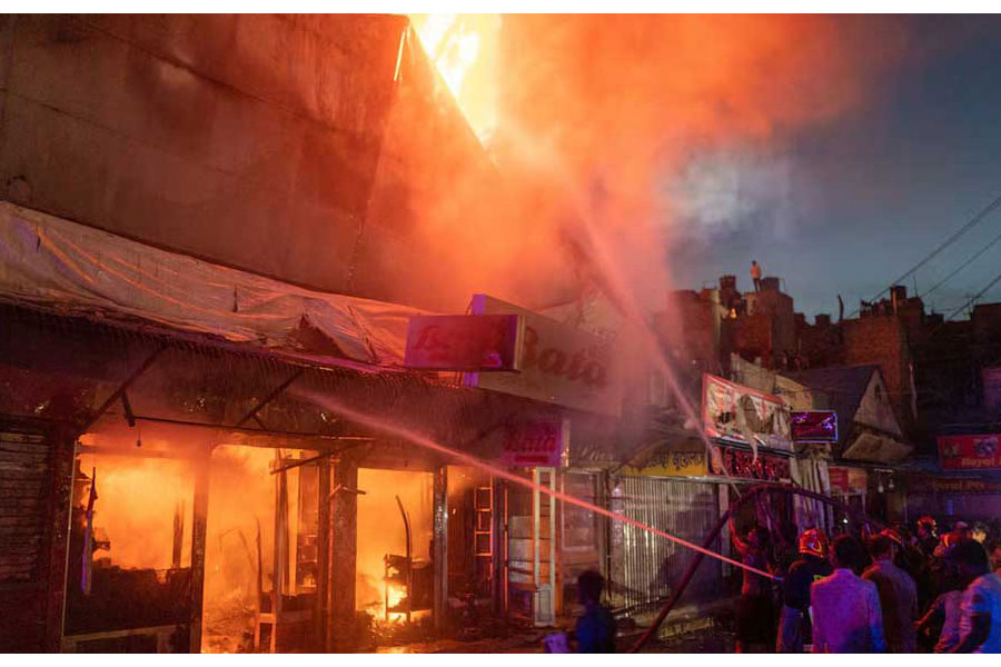 Firefighters work after a fire broke out at the Mohammadpur Krishi Market in Dhaka, Bangladesh, Sept 14, 2023, in this picture obtained from social media. Arshadul Hoque Rocky/via REUTERS