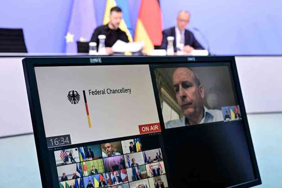 Ukrainian President Volodymyr Zelensky (back L) and German Chancellor Friedrich Merz (back R) attend a video conference of European and world leaders on the Ukraine war, ahead of the summit between US President Trump and Russian President Vladimir Putin, in Berlin, Germany, Aug 13, 2025.