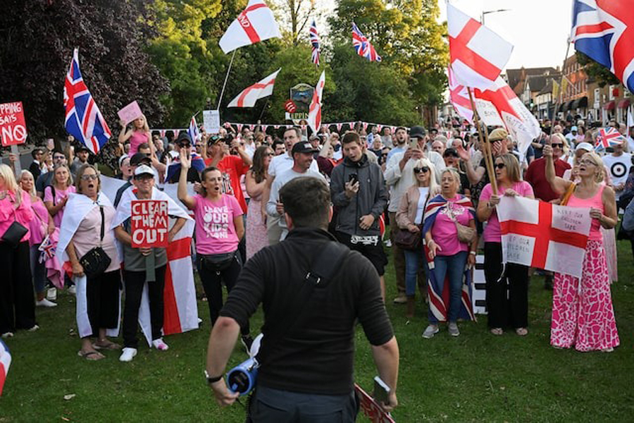 Protesters attend an anti-immigration demonstration, in Epping, Britain, August 8, 2025.
