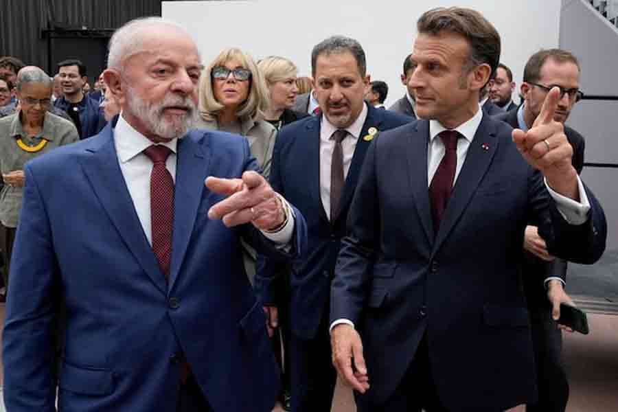 Brazil's President Luiz Inacio Lula da Silva and French President Emmanuel Macron leave after visiting an exhibition by Brazilian artist Ernesto Neto Friday, June 6, 2025 at the Grand Palais museum in Paris, France.