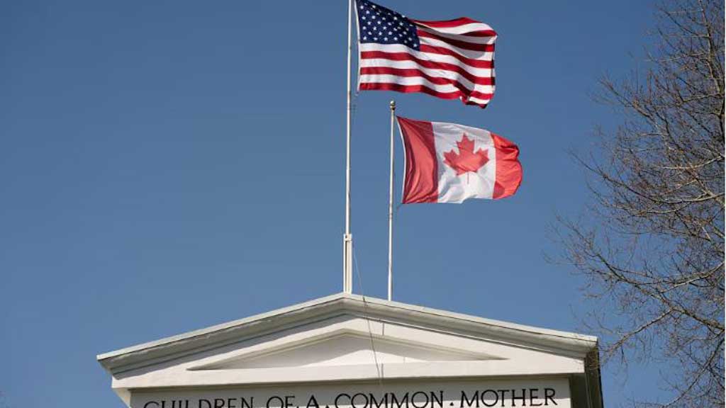 Flags fly above the Peace Arch, at a Canada-US border crossing known as the Peace Arch Border Crossing in Blaine, Washington, US April 2, 2025. REUTERS