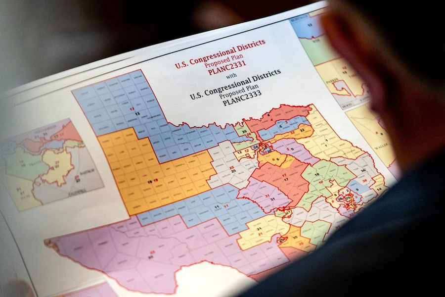 State Representative Matt Morgan (R-TX) holds a map of the new proposed congressional districts in Texas, during a legislative session as Democratic lawmakers, who left the state to deny Republicans the opportunity to redraw the state's 38 congressional districts, begin returning to the Texas State Capitol in Austin, Texas, US, August 20, 2025.
