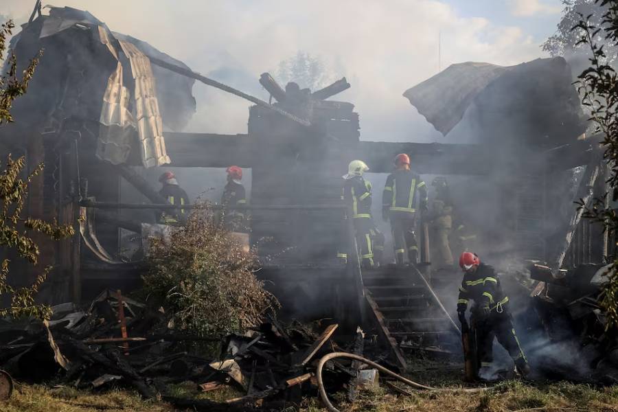 Firefighters work at the site of a Russian missile strike, amid Russia's attack on Ukraine, in the village of Sknyliv on the outskirts of Lviv, Ukraine August 21, 2025.