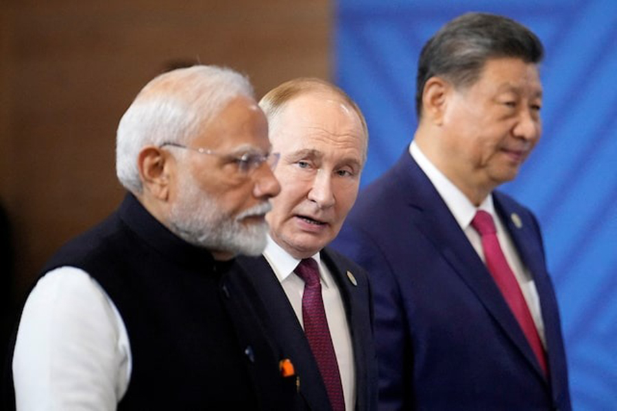 Indian Prime Minister Narendra Modi, Russian President Vladimir Putin and Chinese President Xi Jinping attend a family photo ceremony prior to the BRICS Summit plenary session in Kazan, Russia on Wednesday, October 23, 2024 — Pool via Reuters/File