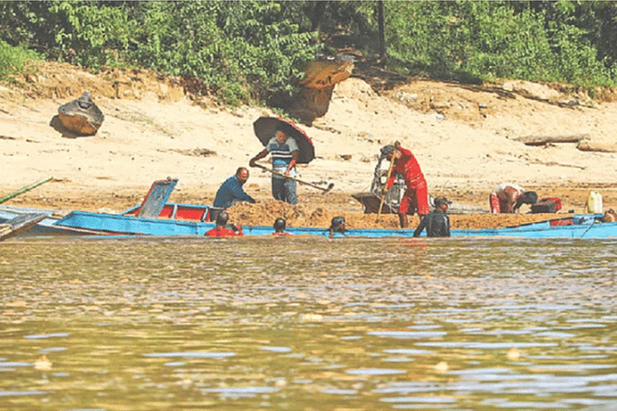 The photo shows sand extraction in Gowainghat upazila of Sylhet distric