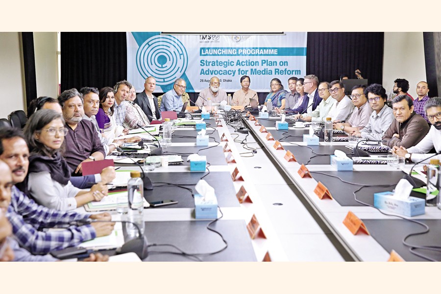 The participants pose for photos during the launching ceremony of the five-year Strategic Action Plan on Advocacy for Media Reform in Bangladesh (2025-2030) in the capital on Tuesday. — FE Photo