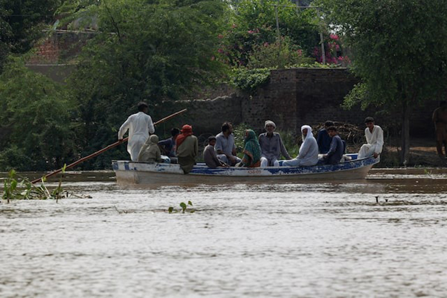 Residents use a boat to reach their destination in flooded areas due to the monsoon rains and rising water level of the Sutlej River, in Hakuwala village near the Pakistan-India border in Kasur district of the Punjab province, Pakistan on August 23, 2025 — Reuters photo