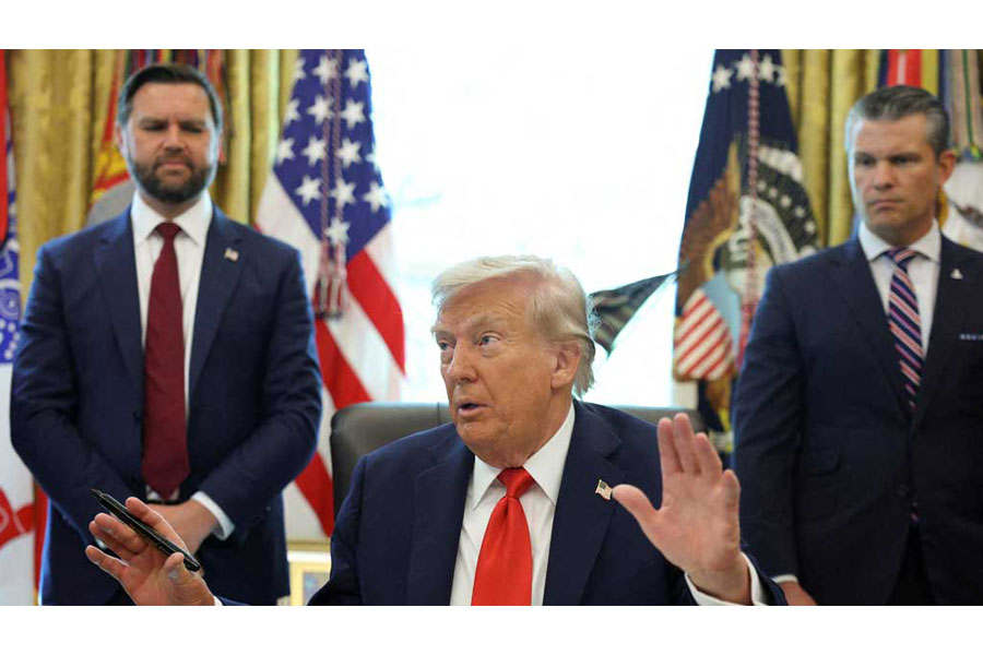 US President Donald Trump speaks after signing an executive order, as US Vice President JD Vance and US Defense Secretary Pete Hegseth look on, in the Oval Office at the White House in Washington, DC, US, Aug 25, 2025. REUTERS/Jonathan Ernst