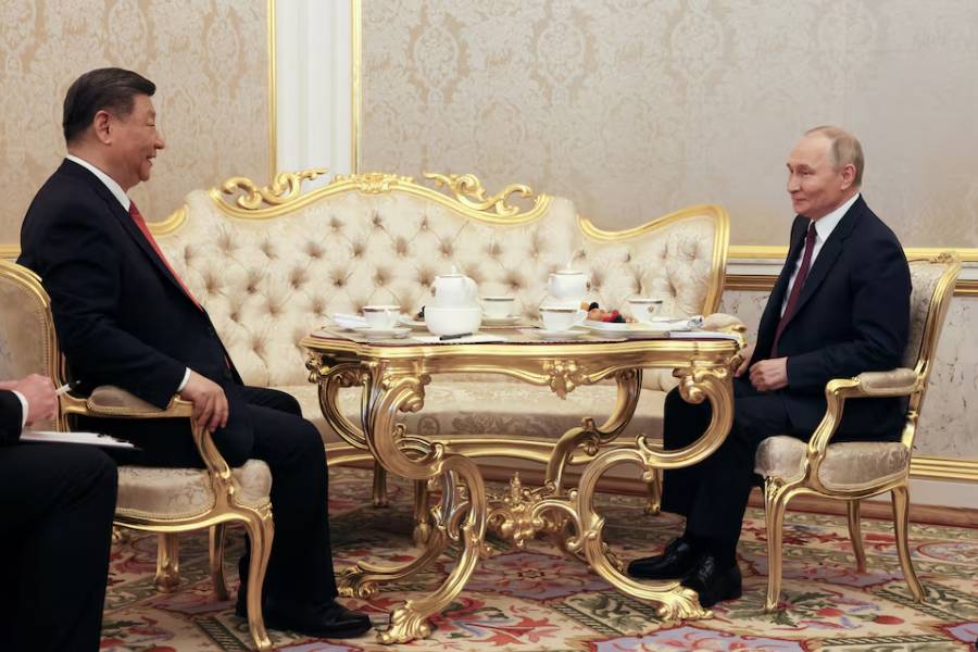 Russian President Vladimir Putin and Chinese President Xi Jinping have tea following their talks in Moscow, Russia, May 8, 2025.