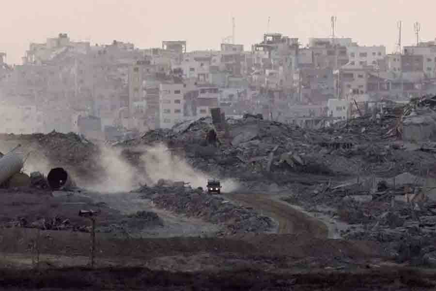 A military vehicle manoeuvres in Gaza, as seen from the Israeli side of the border Aug 28, 2025.
