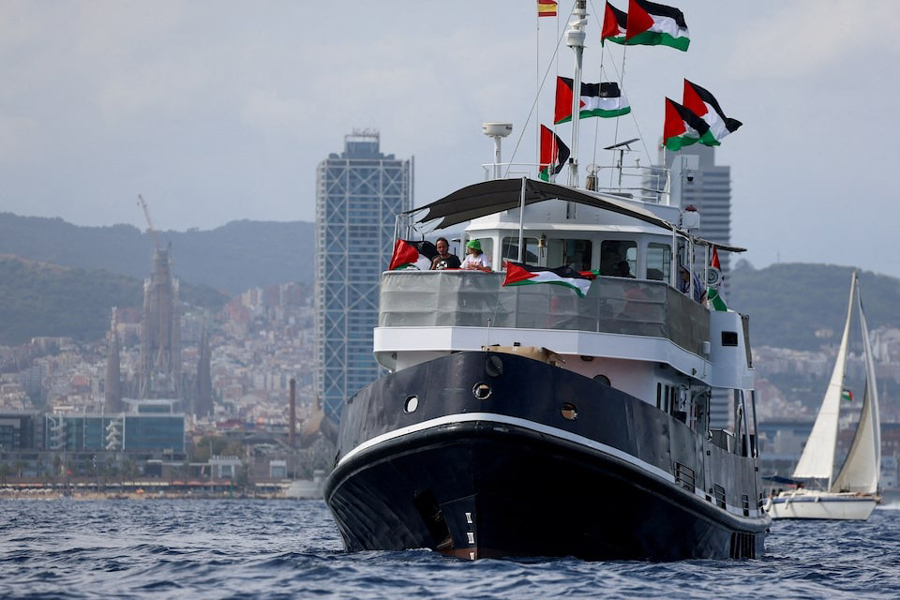 Swedish activist Greta Thunberg departs with other activists on the Global Sumud Flotilla, a humanitarian expedition to Gaza, from the port of Barcelona, Spain August 31, 2025. The Sagrada Familia is seen in the background.