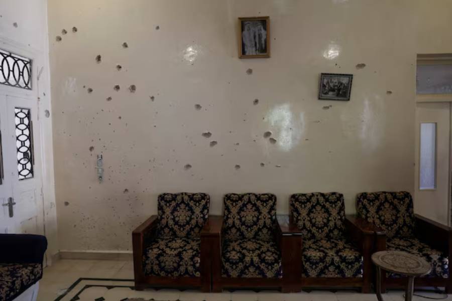 A wall is pockmarked by bullet holes inside the Saraya family house, following sectarian violence in Syria's Sweida province, where government forces were sent to quell local clashes between Druze armed factions and Bedouin tribal fighters, in the predominantly Druze city of Sweida, Syria, July 25, 2025.