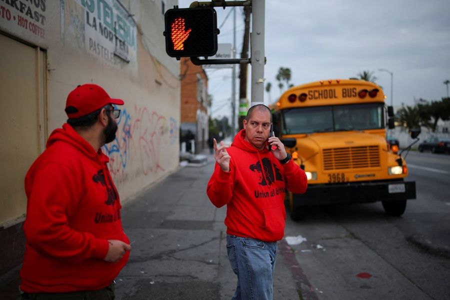 Ron Gochez, volunteer with immigrant rights advocacy group Union del Barrio, patrols for US Immigration and Customs Enforcement activity in South Los Angeles, California, US, March 5, 2025.
